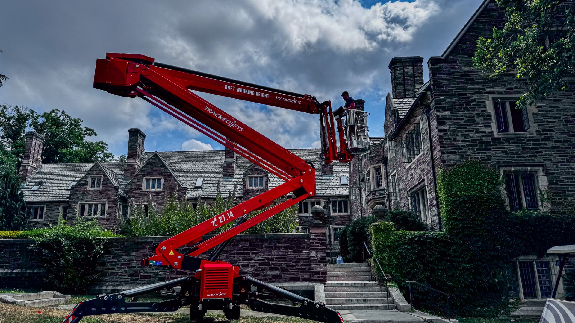 Tracked Lifts 27.14 spider lift working on a historic stone building